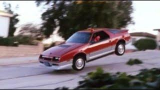 '84 Dodge Daytona Turbo chases  '82 Olds Firenza