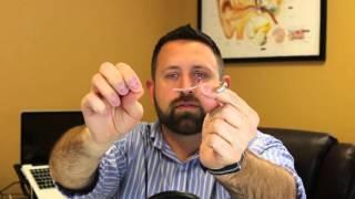 How do I clean my hearing aid?