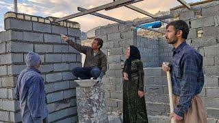 "Dream house: Yousef and Noorbakhsh's efforts in preparing the roof construction"