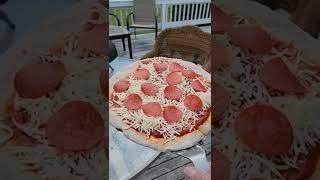 making a delicious home made pizzq