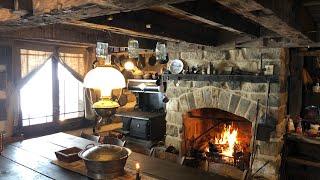 Constructing an authentic stone fireplace in the 1800s log cabin restoration￼.