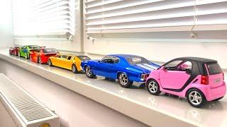 Bigger Sized Diecast Cars driven by hand on the windowsill