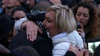 Blindfolded Muslim man offers hugs to mourners