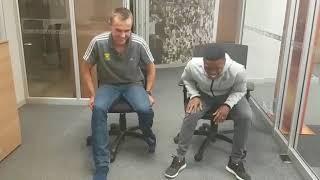 Thabiso Khambule and LJ van Zyl race around the office