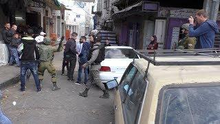 Israeli soldier beats Palestinian teen in the head with gun, during settler procession, Hebron