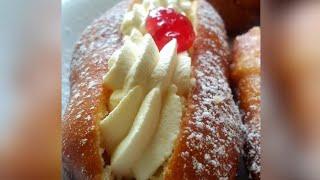 Fresh cream doughnuts with glazed cherries.