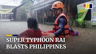 Super Typhoon Rai slams through the Philippines forcing tens of thousands to evacuate