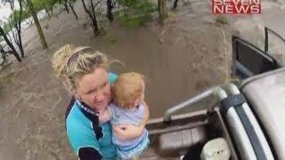 Dramatic flood rescue: Toddler winched from submerged truck in Australia