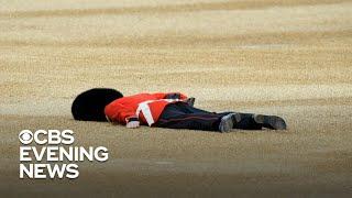 The Queen's Guards try not to faint as temperatures soar