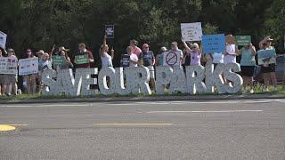 'Save our parks': Hundreds protest proposed developments inside Anastasia State Park