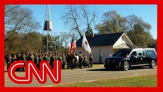 Jimmy Carter’s motorcade passes his boyhood home for the last time