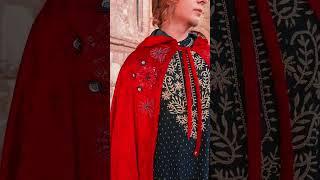 red velvet cloak, adorned with intricate spider embroidery