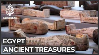 Egypt unveils scores of ancient coffins, statues found in Saqqara