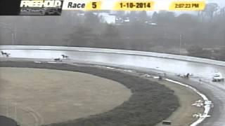 Accident at Freehold Raceway track involving horses and a pace car