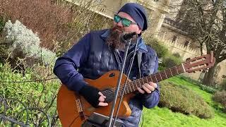 Guitar player from Hungary Laszlo Jakab busking in Brighton Royal Pavilion.