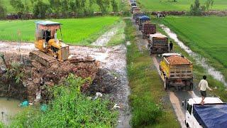 NEW !! Road repair next to the canal by Bulldozer pushing Soil with 5 tons of garbage trucks