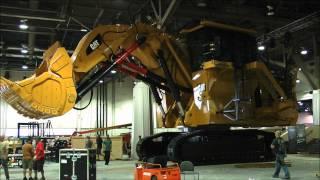 moving huge Caterpillar 6030B excavator