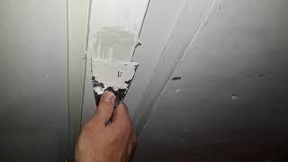 Applying filler to a dent in a door post 02