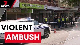 Shopkeeper stabbed in random attack at Port Melbourne - Police hunting for suspect | 7NEWS