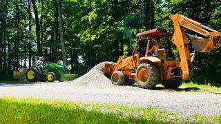 Spreading Gravel on the Farm: Case backhoe and John Deere compact tractor team up!