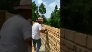 The process of masonry building walls. Good tools to help with masonry