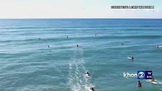 Apparent large shark swims among surfers off Ewa Beach