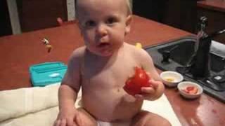 Baby Eating Tomato