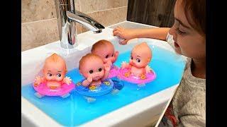 Baby Dolls Swimming in the Sink