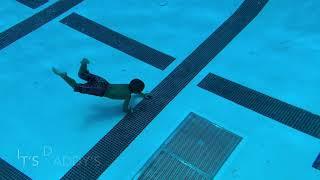 4years old jump and dive 12 feet deep pool  to get a watch