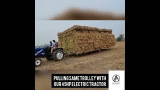 AutoNxt - 45HP Electric Tractor pulling heavy load through uneven farmland, on slope and on road.