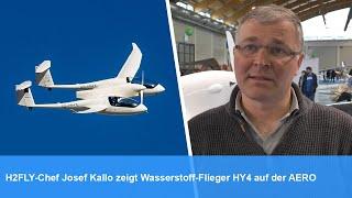 H2FLY-Chef Josef Kallo zeigt Wasserstoff-Flieger HY4 auf der AERO