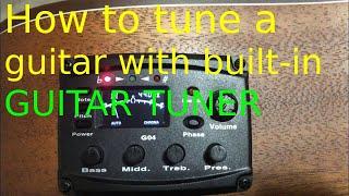 HOW TO TUNE A GUITAR WITH BUILT-IN GUITAR TUNER...
