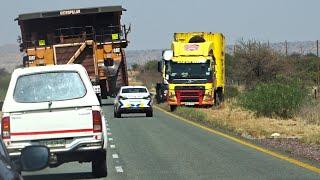 Traffic on the N14 behind an overloaded truck near Olifantshoek in South Africa