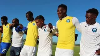 Richards Bay FC Coach celebrates with players after win