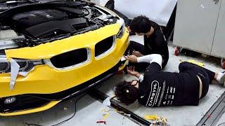 Process Of Turning Old BMW Into New Yellow Car. Korean Car Wrapping Technician
