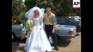 SOUTH AFRICA: ANGLICAN PRIEST PRESIDES OVER GAY WEDDING
