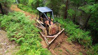 Salvaged Vintage International TD9-92 Dozer clearing an overgrown Forest Road