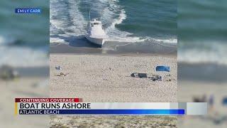 Witnesses capture video, photos of moment boat runs ashore in Atlantic Beach