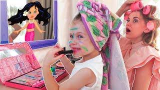 Eva as a mother learns to use baby cosmetics. Baby makeup