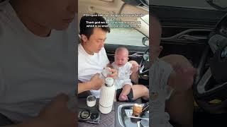 The dad holds the baby with one hand and makes milk in 20 seconds. No need to rush to drink milk