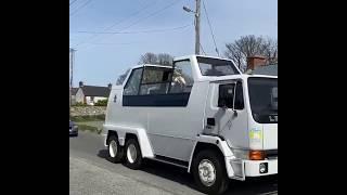 Drive-By Blessing: Fr Malachy Conlon rides the Popemobile around the Cooley Peninsula