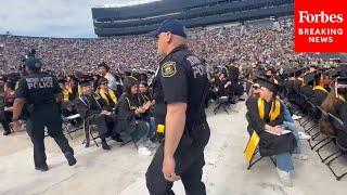 BREAKING: Police Officers Remove Protesters From The University Of Michigan’s Commencement Ceremony