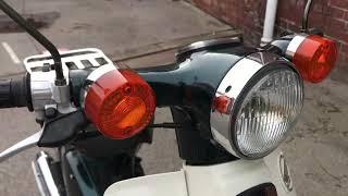 2002 Honda C90 dark metallic green