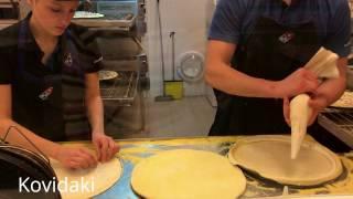 Making pizza in a pizzeria.