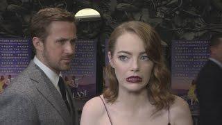 La La Land gala: Ryan Gosling creeps up on Emma Stone!