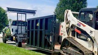 Hauling a Skid Steer in a Dumpster