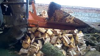 Splitting firewood with massey ferguson 698T and hydrocrack splitter