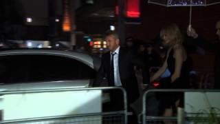 Charlize Theron and Sean Penn arrive at The Gunman premiere