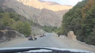 Pamir Highway: driving between Kuljab and Khalaikum, passing Tajik villages