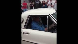 Jay Leno leaving in his Mazda Cosmo